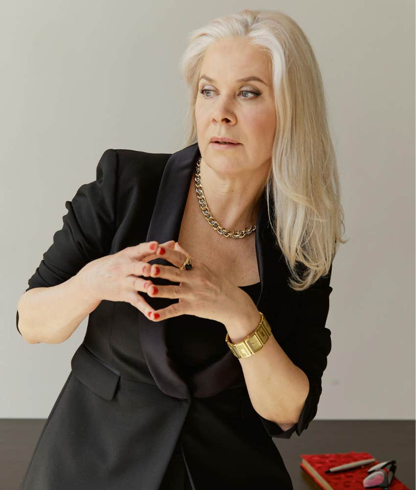 older woman wearing a black blazer 