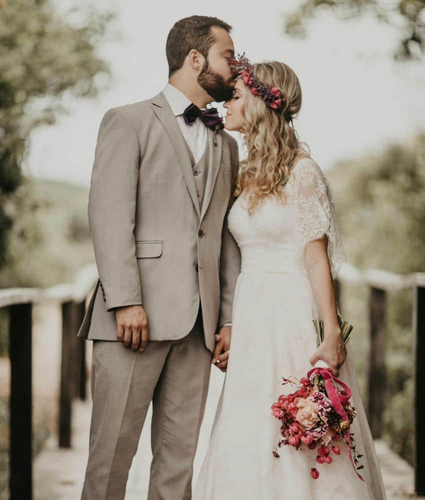 groom kissing bride