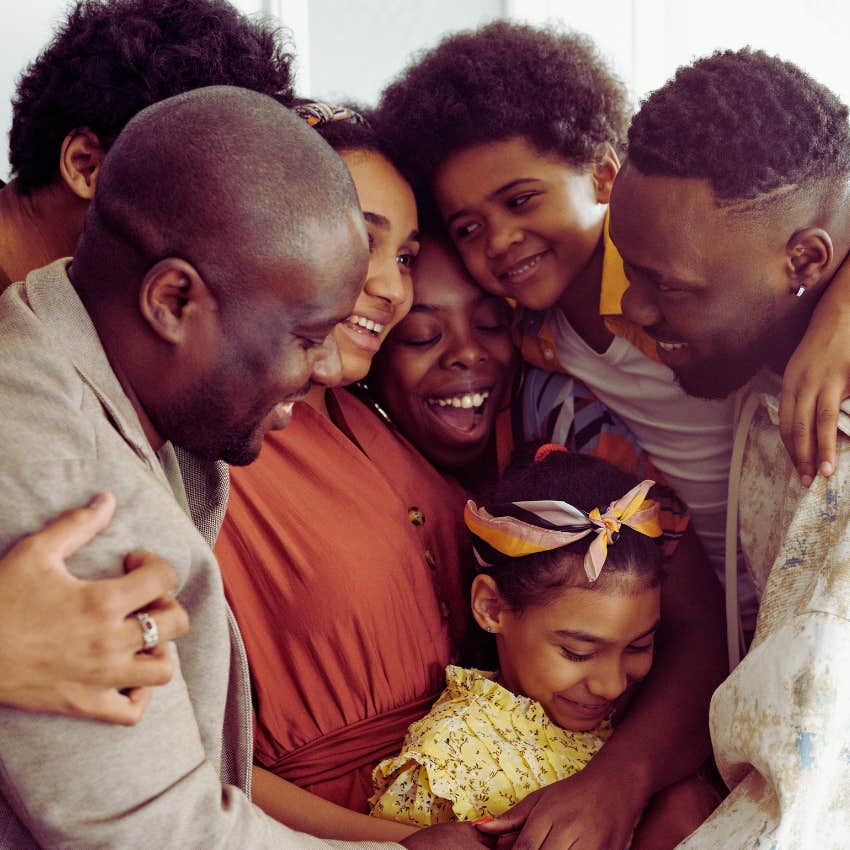 happy loving family hugging
