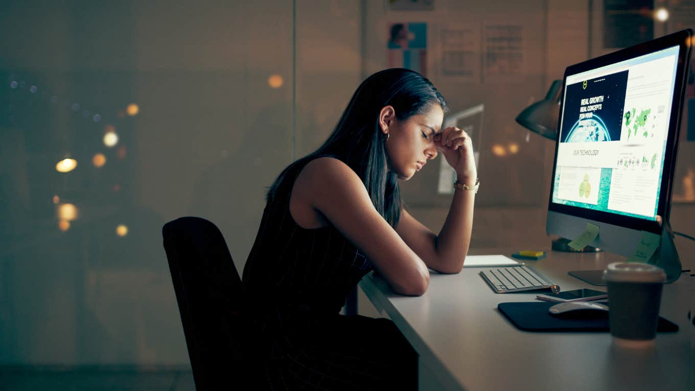 High Achievers' Four Thoughts That Indicate Burnout, According To A Career Coach woman suffering from four thoughts that indicate burnout