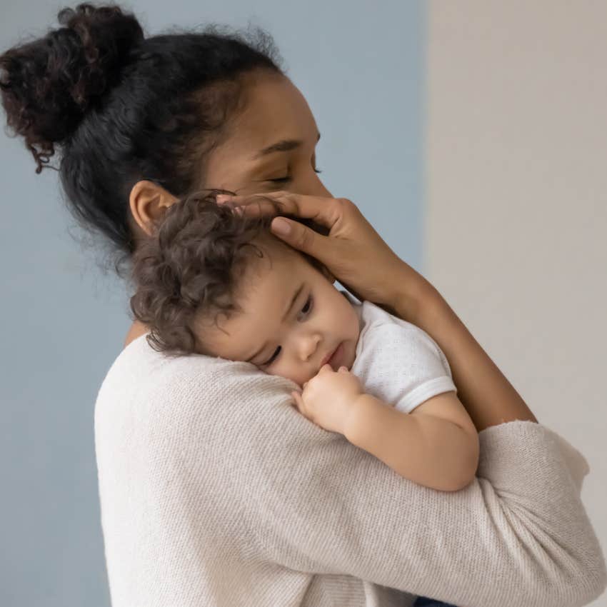 young mother holding baby