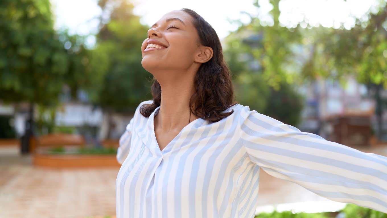 Woman practicing mindset trick to raise her confidence