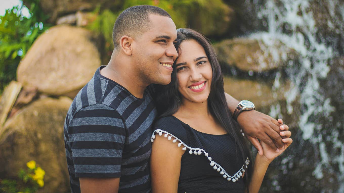 If Your Partner Does These 5 Things, They Have A Secure Attachment Style man and woman with their arms around each other