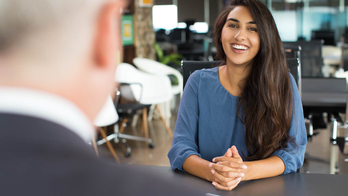 Job Interview Canceled When Worker Refuses To Disclose Salary woman smiling during job interview