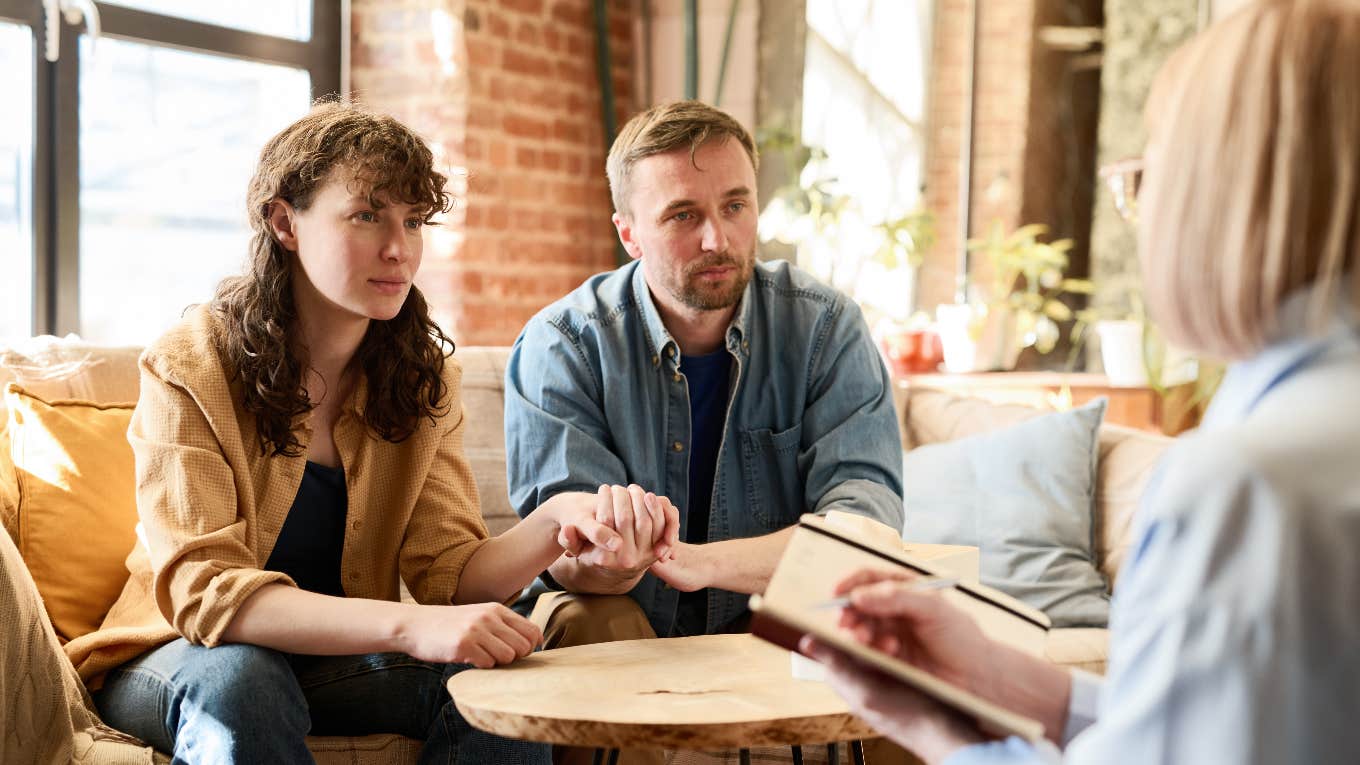 couple holding hands in therapy