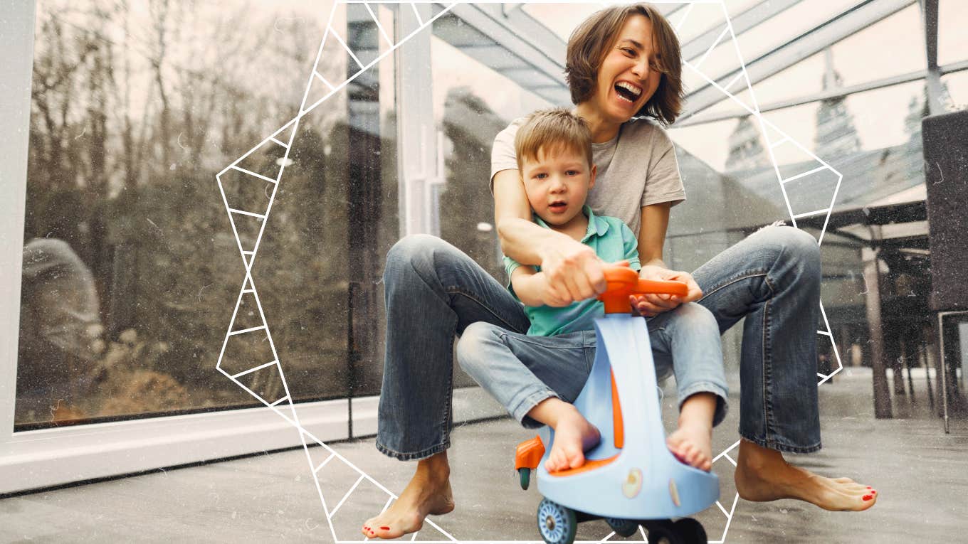 Single mother on scooter with a little boy, laughing