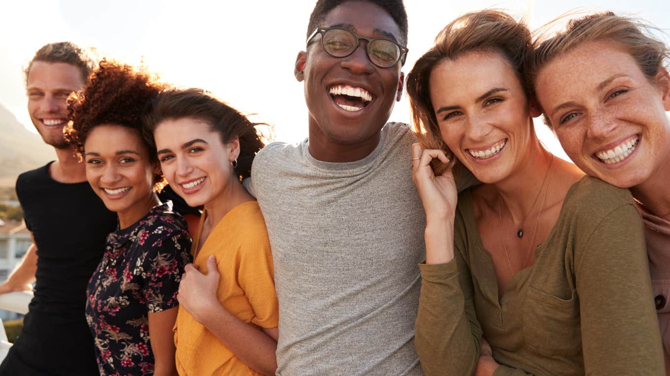 group of young people laughing together