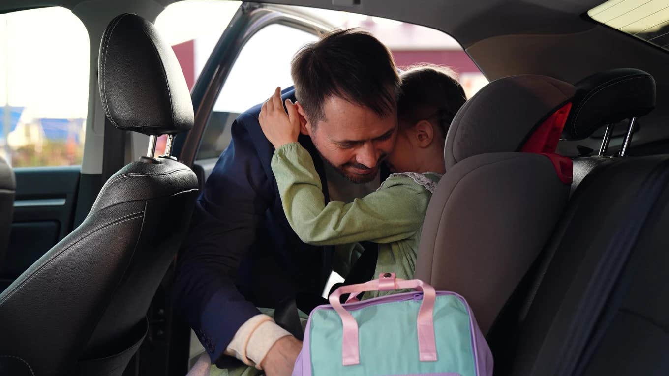 Man Questions If He's Wrong For Forcing His 12-Year-old Niece To Use A Booster Seat In The Car Father unfastens child's seatbelt in booster seat
