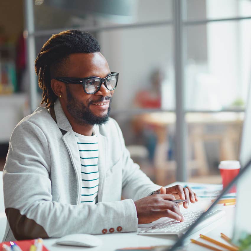 man working at desk in office 
