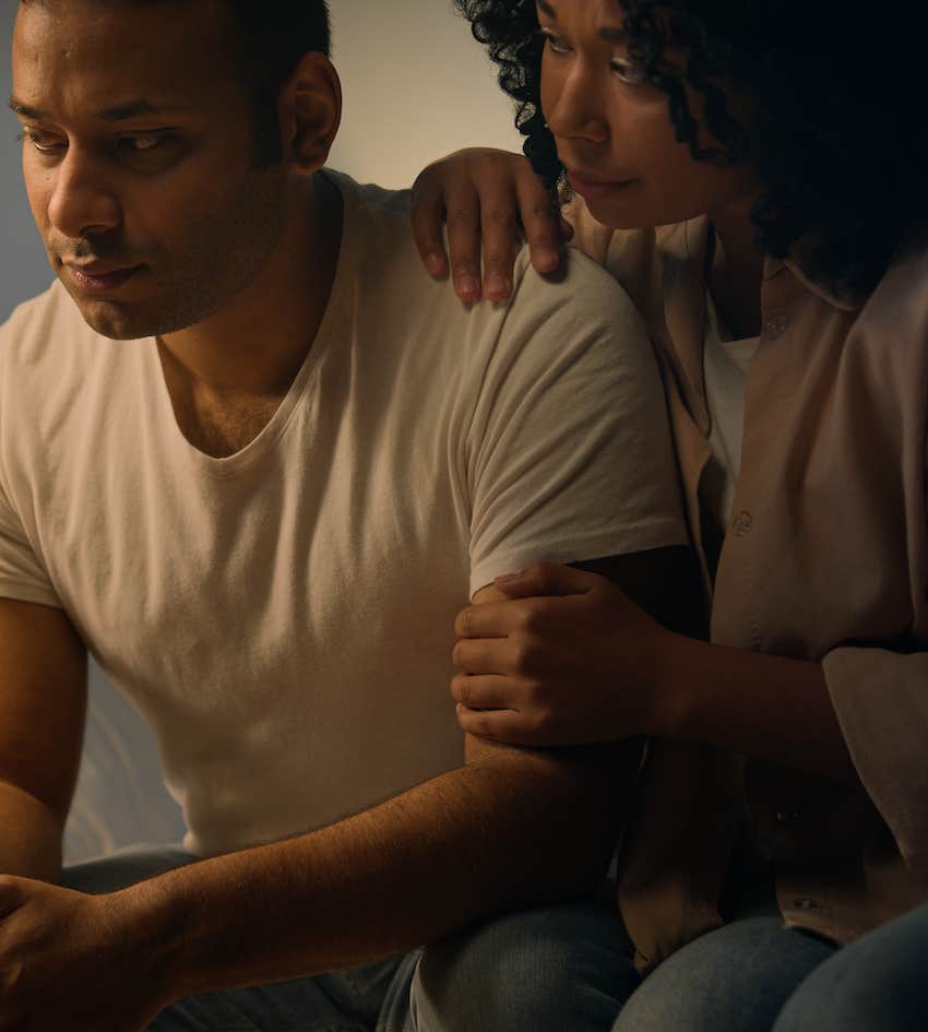 Couple having emotional conversation about men's feelings