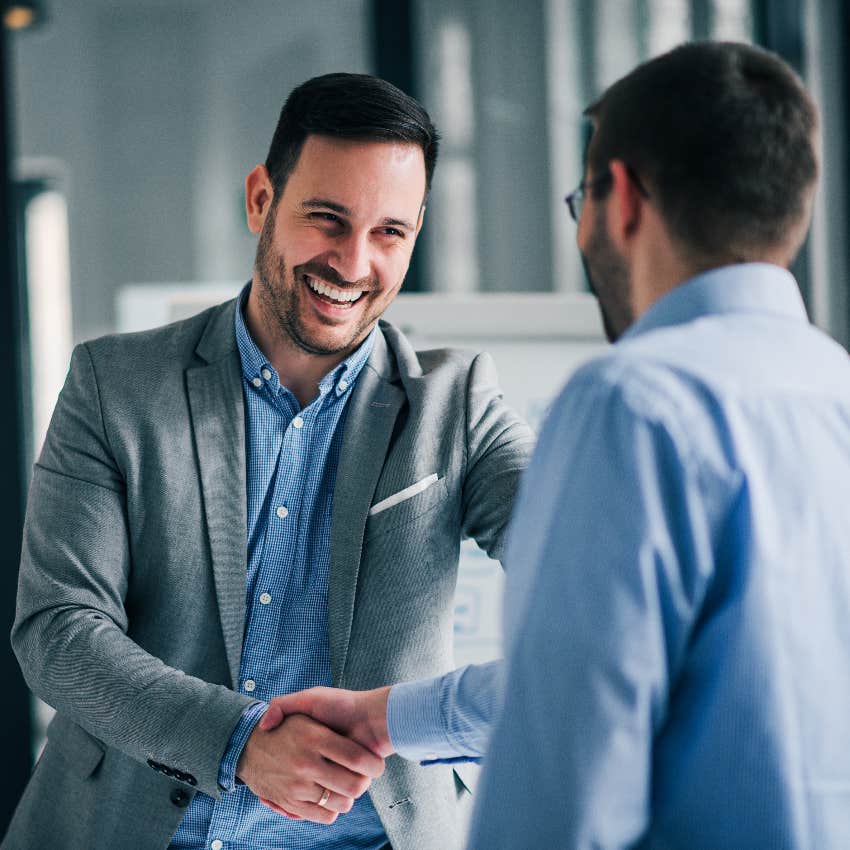 Businessmen shaking hands at work