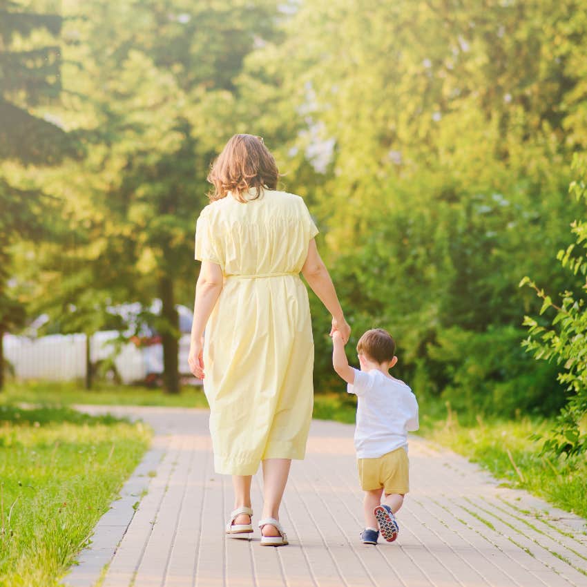 Mom taking anxious child on a walk
