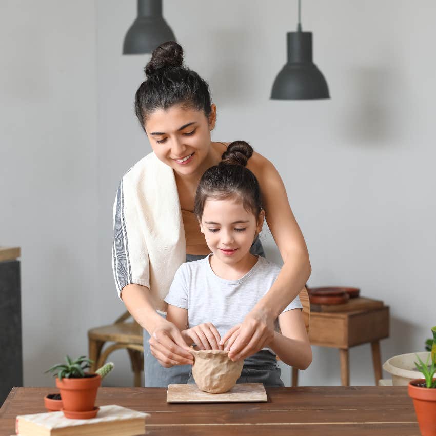 Mom and daughter doing pottery together