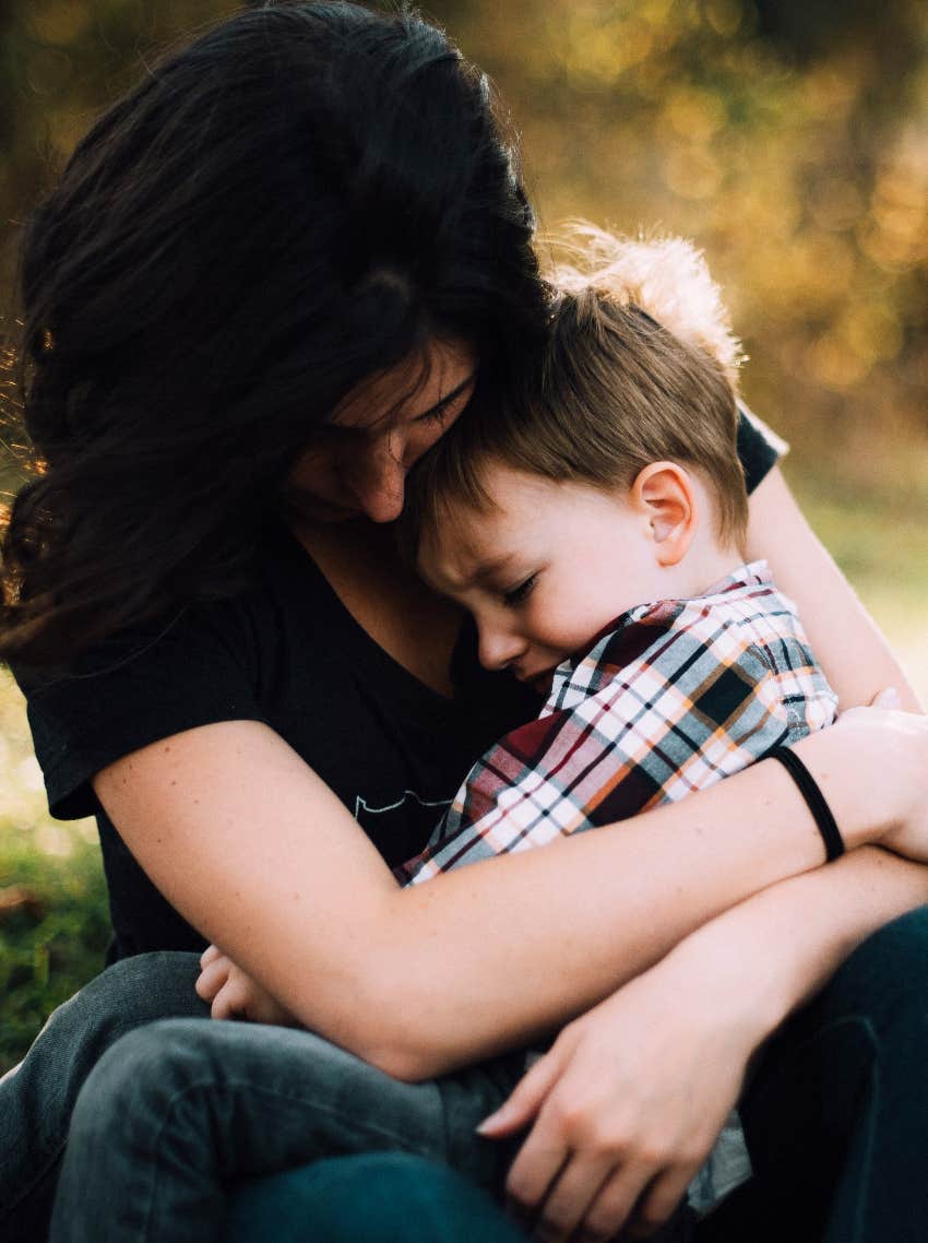 mother consoling emotional child