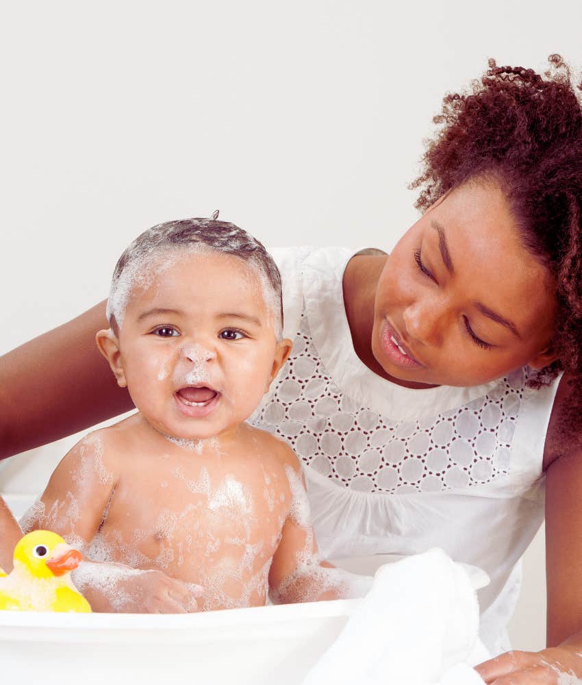 mom giving baby a bath