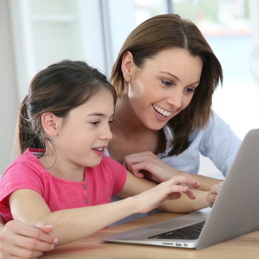 Mom helping daughter use Chat GPT On An Assignment