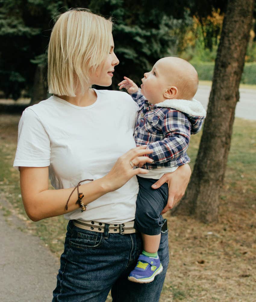 mom holding a baby 