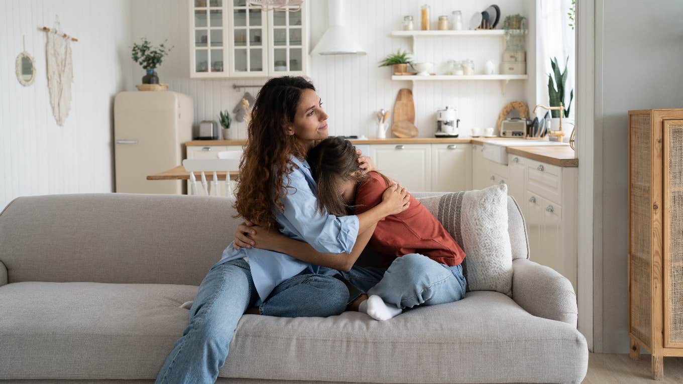 Mom comforting daughter after being suspended