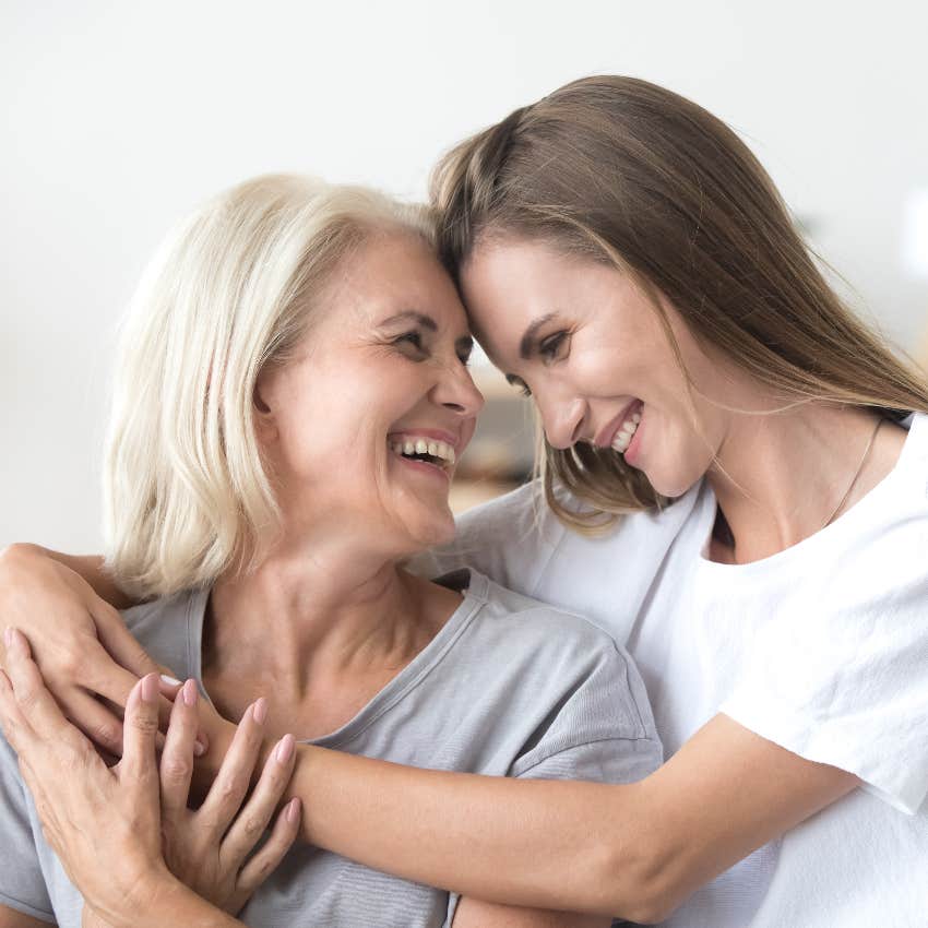 mother and adult daughter hugging