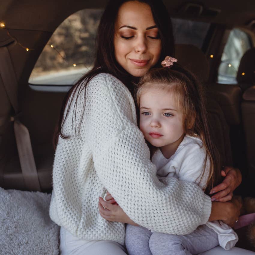 mom hugging daughter