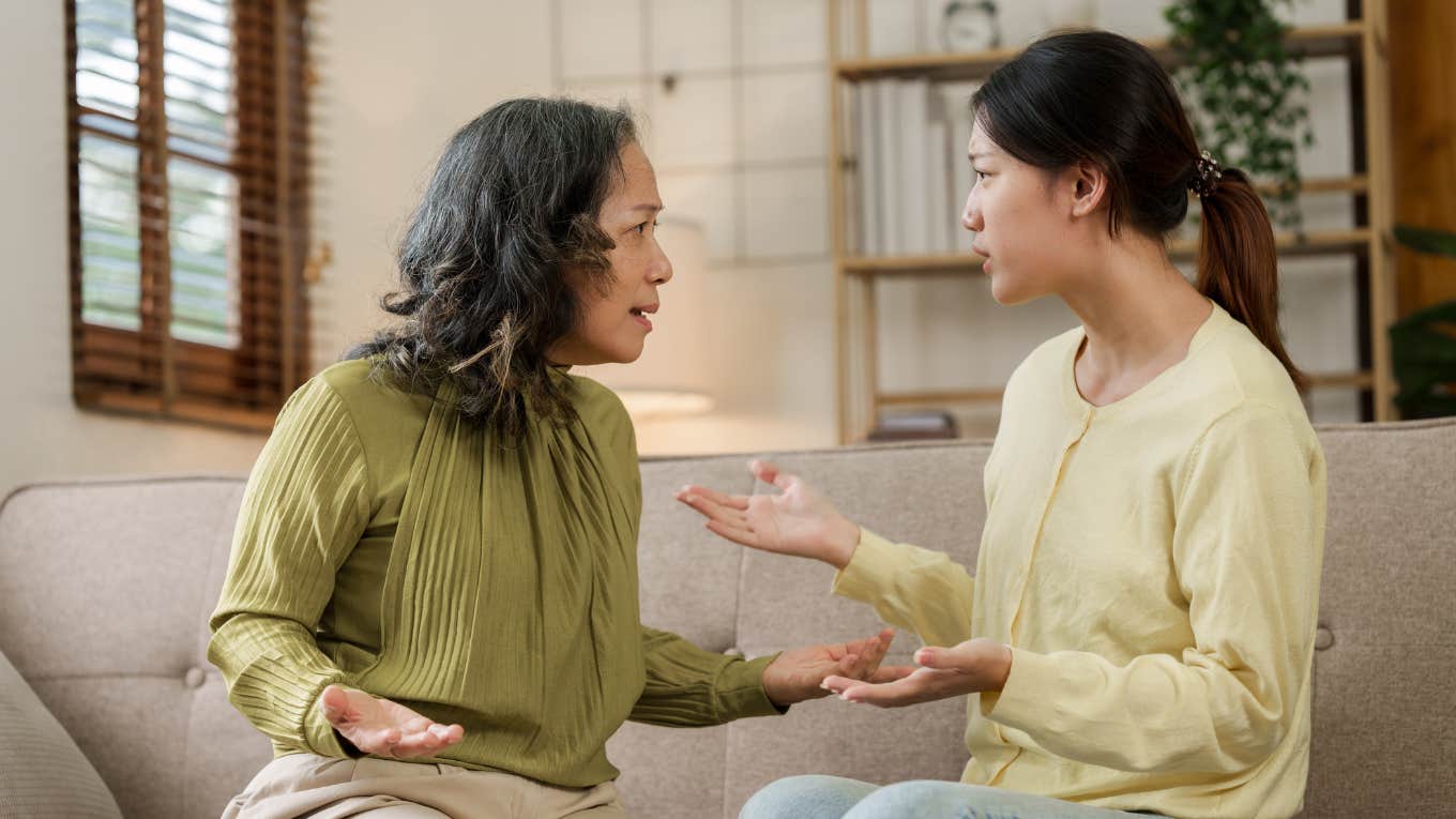 Mother Refuses To Give Handouts To Enabled And Ungrateful Adult Daughter Who Takes Advantage Of Her mom and adult daughter have fight at home while sitting on sofa.