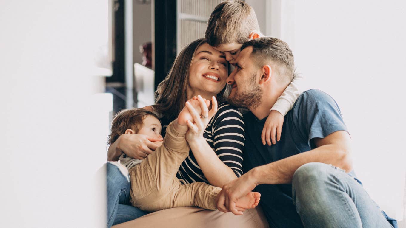 What You Need To Know If You Want To Raise A Well-Behaved Child family laughing together and hugging