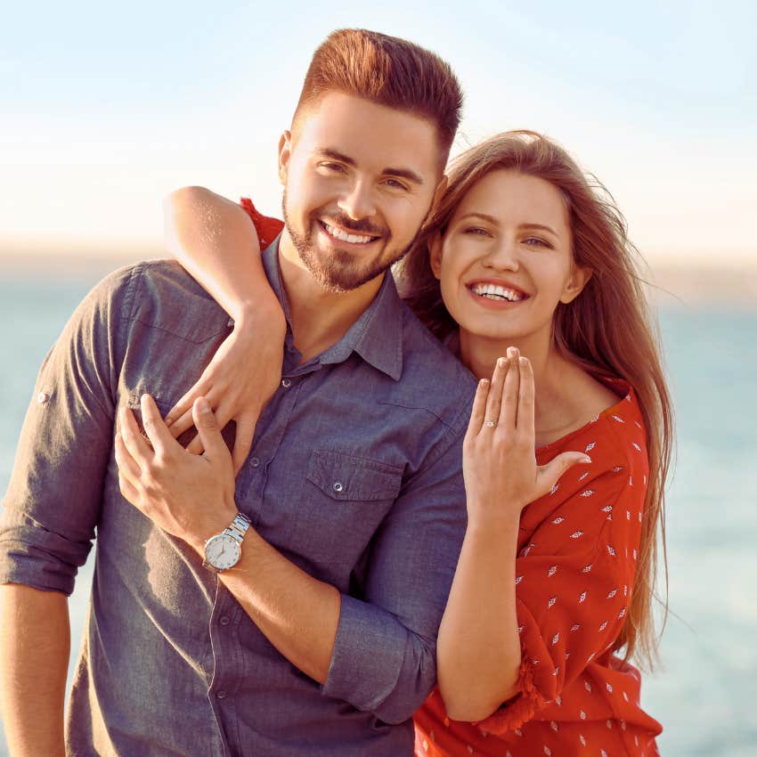 newly engaged couple showing off ring