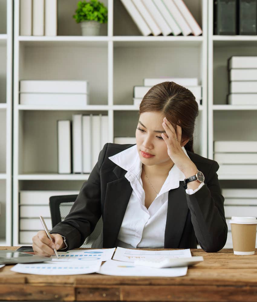 overworked executive sitting at desk