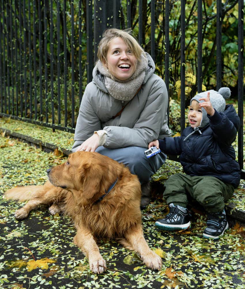 mom and son with a dog