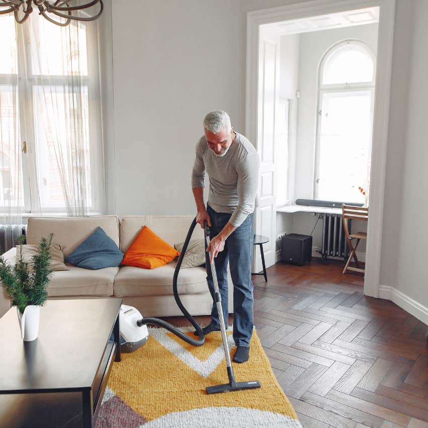 man vacuuming