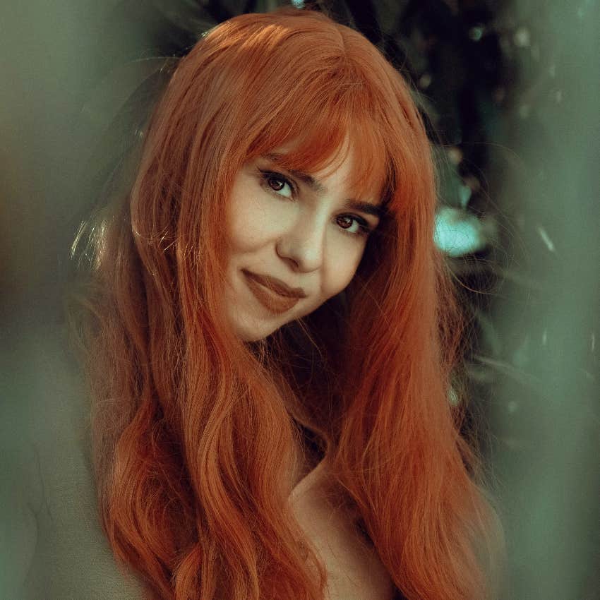 red-headed woman smiling disciplined