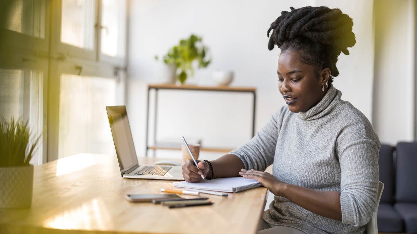 Remote worker working at a home desk. 