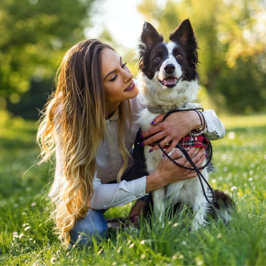 woman hugging a dog 