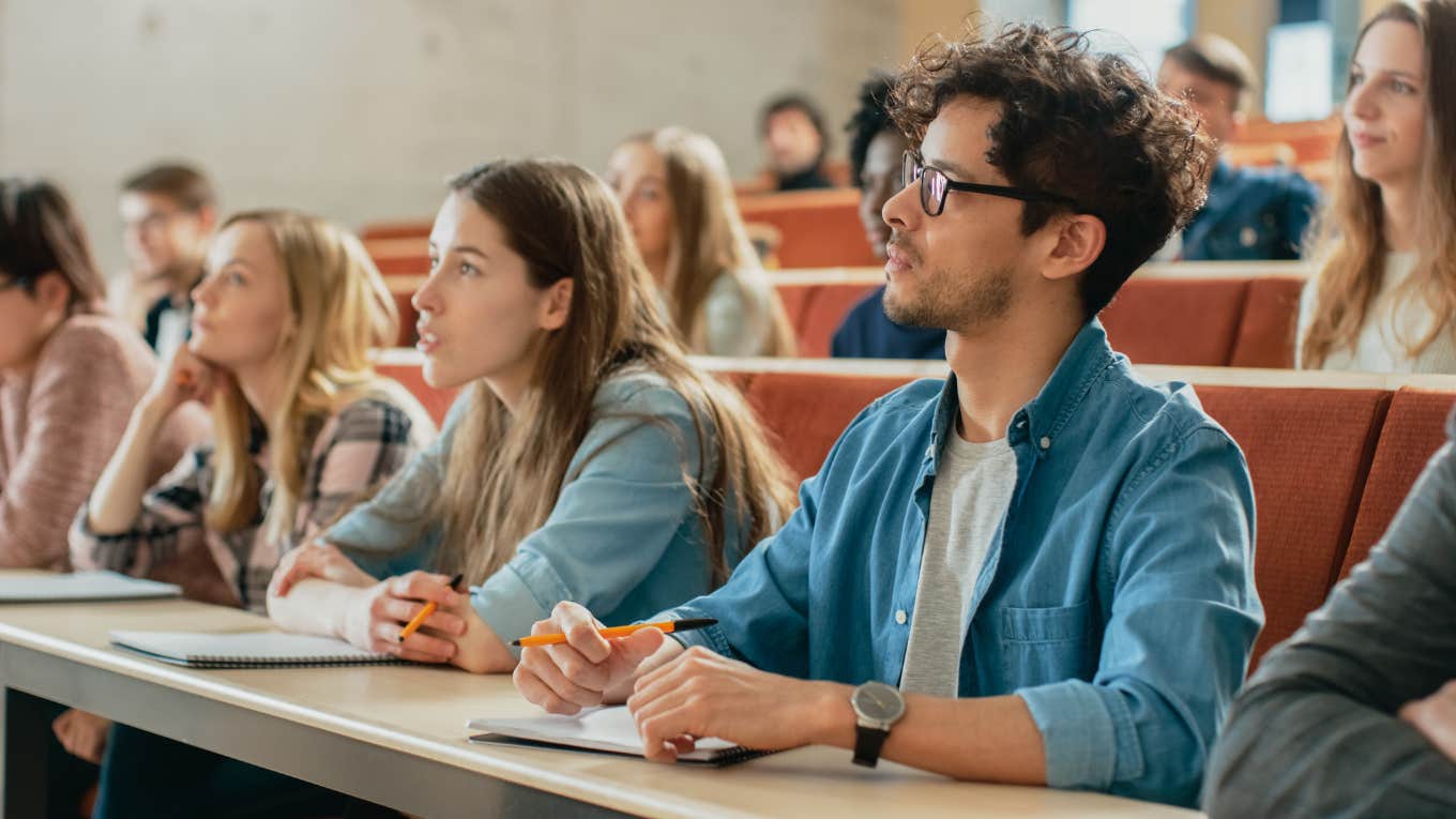 School Admin Struggles To Control 9th Graders After They Protest Against Taking State Exam Students Listening to a Lecturer and Writing in Notebooks