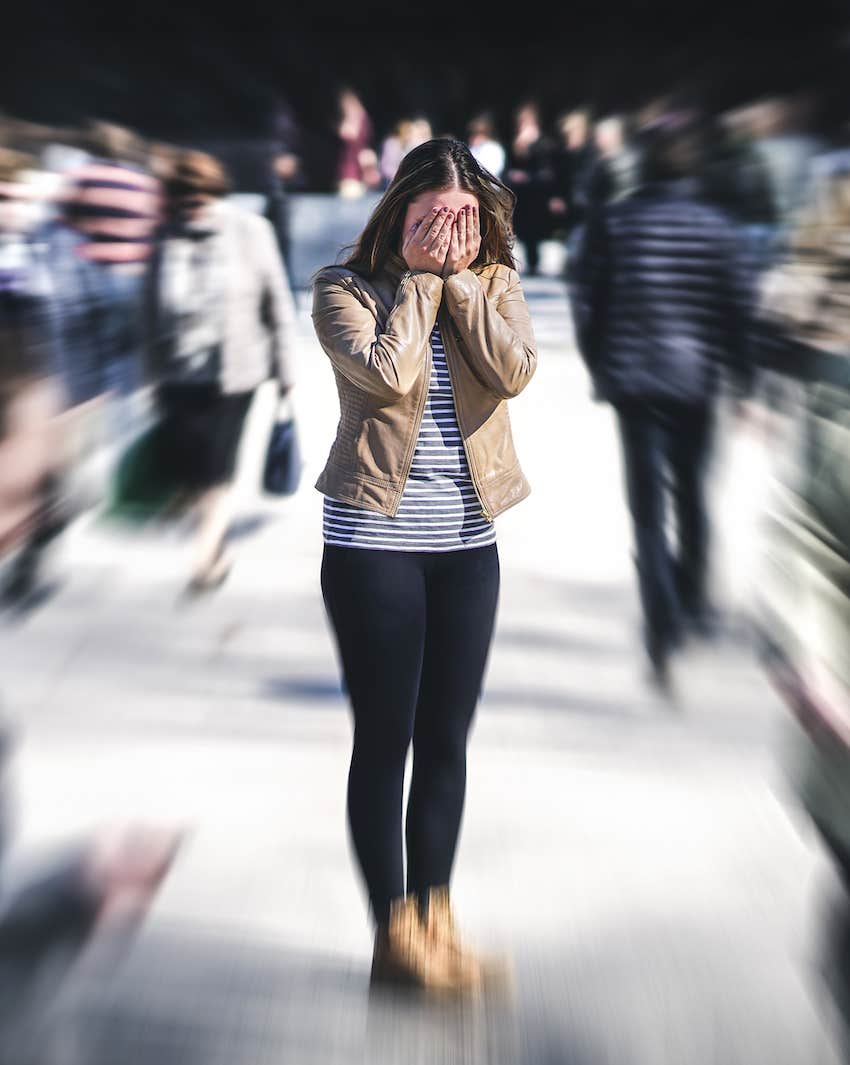 Woman panics in crowd trying to be happy