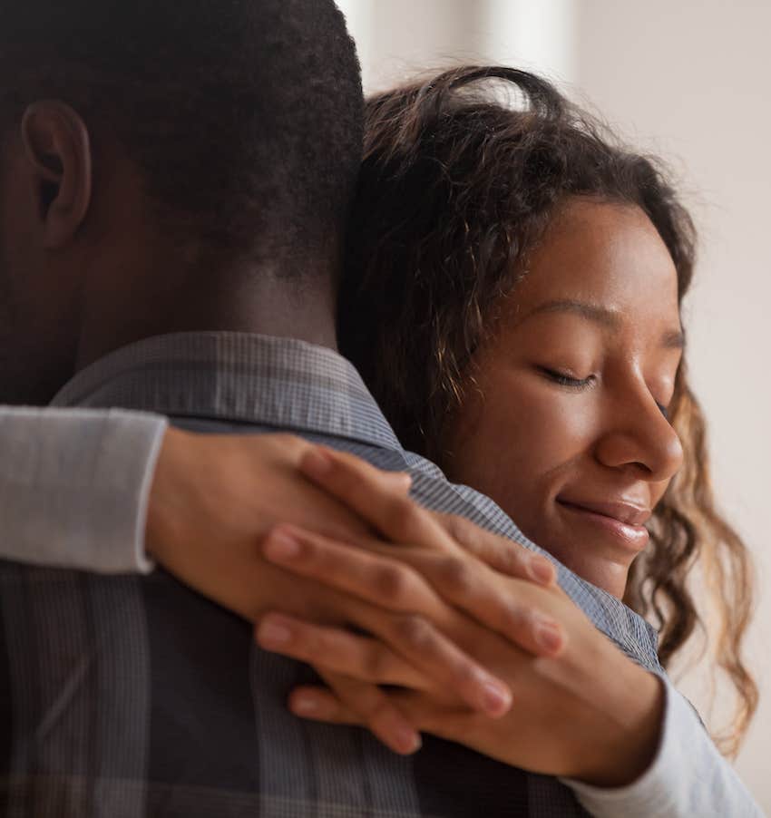 Couple hugs after surviving betrayal