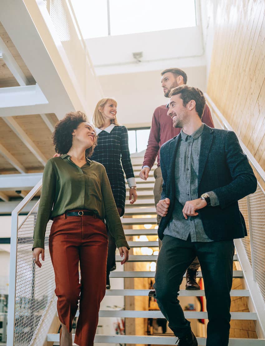 Four coworkers walking down the stairs are they dating at work