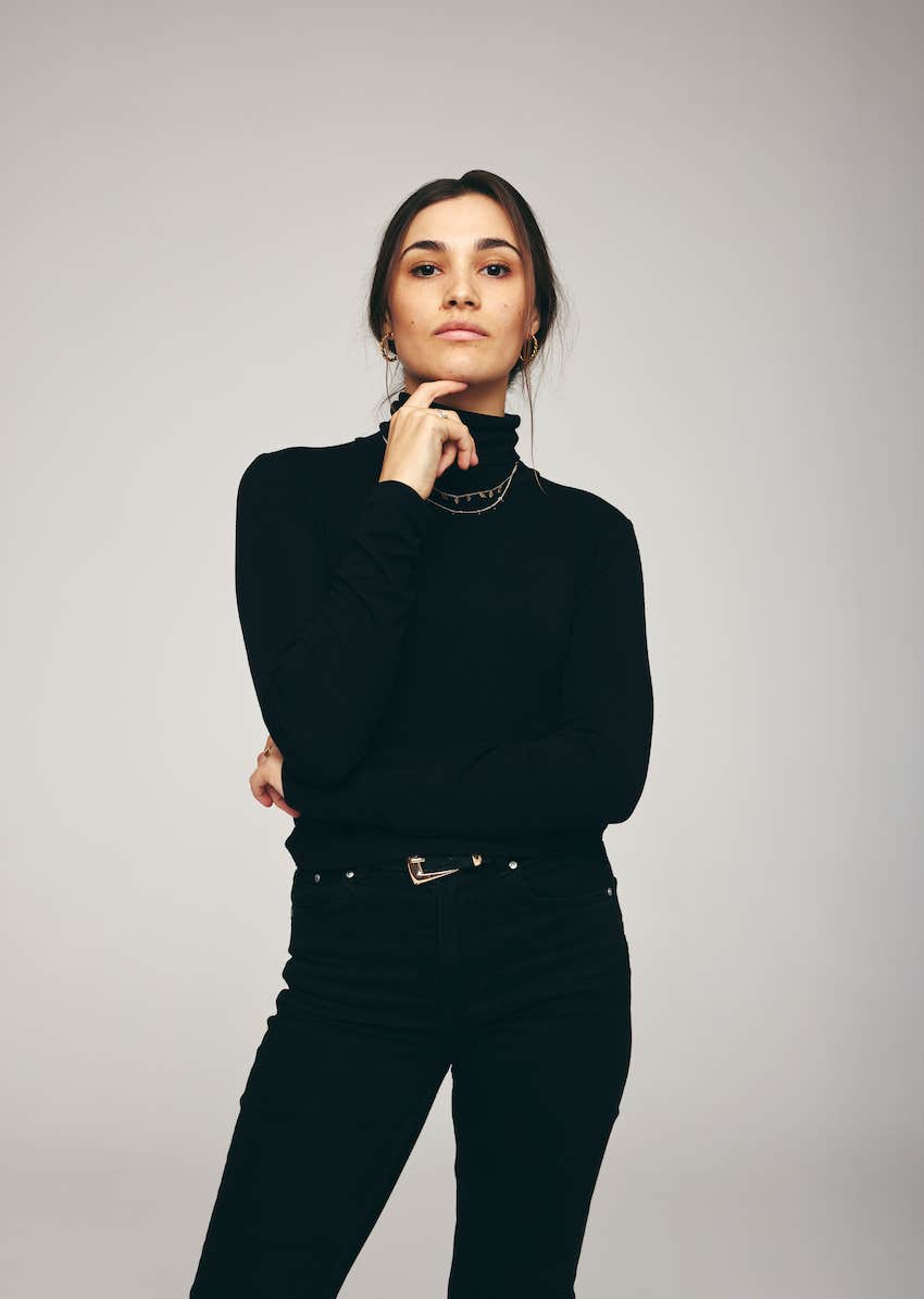 Confident woman looks in camera and is strong after her husband's affair