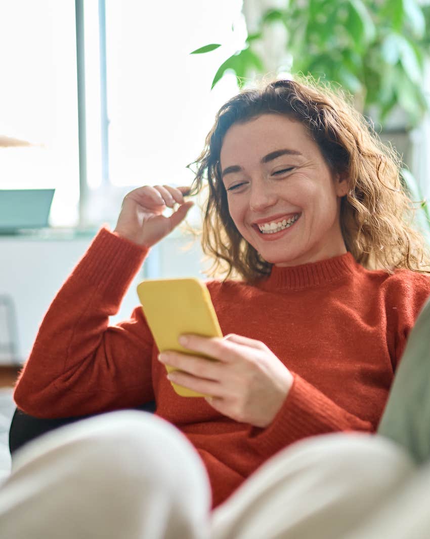 She receives a happy text message from her date