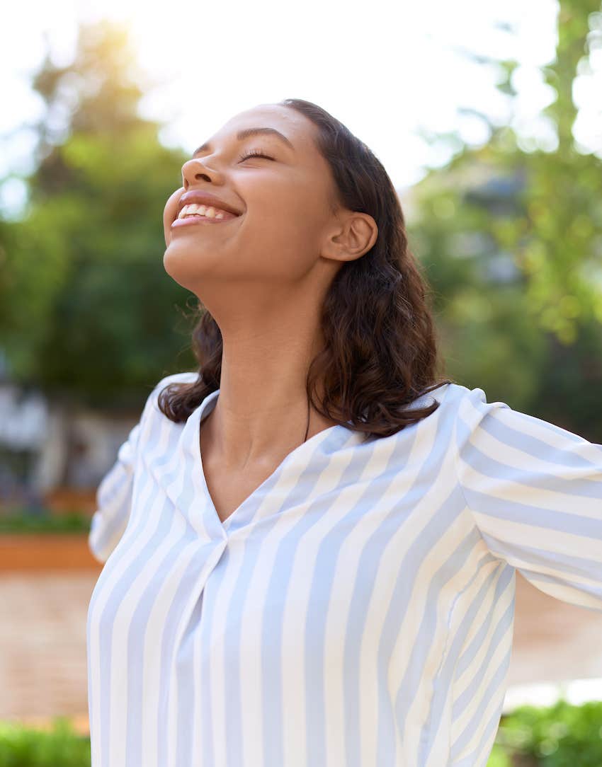 Joyful woman realizes Blaming Others Doesn't Work Anymore