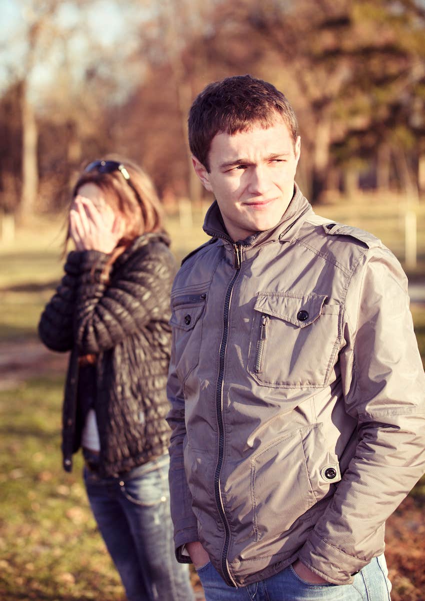 Tension between couple, he looks away, she covers her face, there is jealousy in the relationship