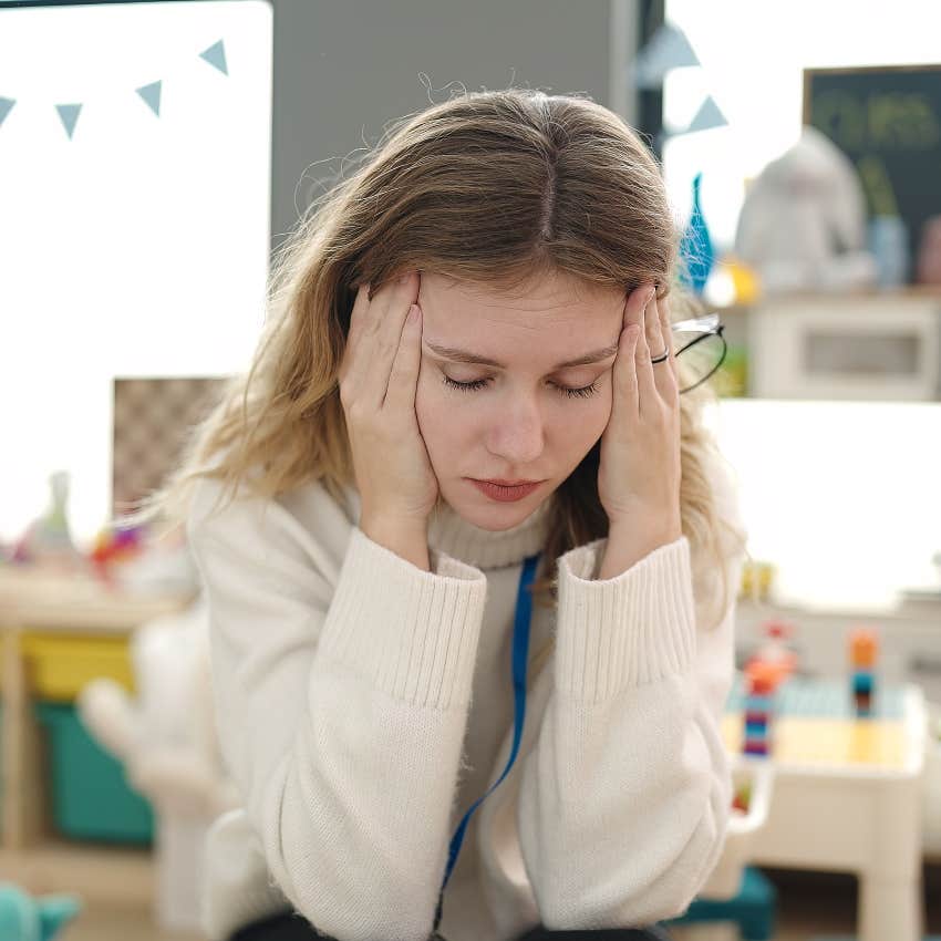 Stressed out teacher in classroom