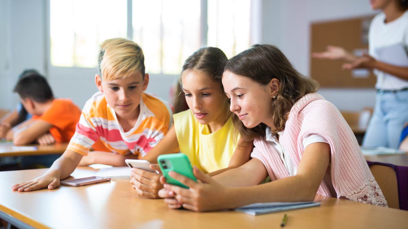 Group of students on phones in class