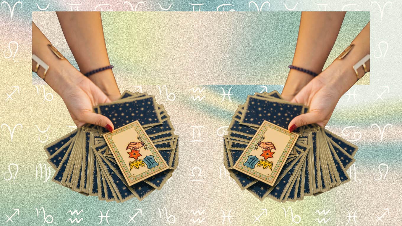 Each Zodiac Sign's Tarot Card Reading For May 30, 2024 hand holding tarot cards for horoscope reading may 30