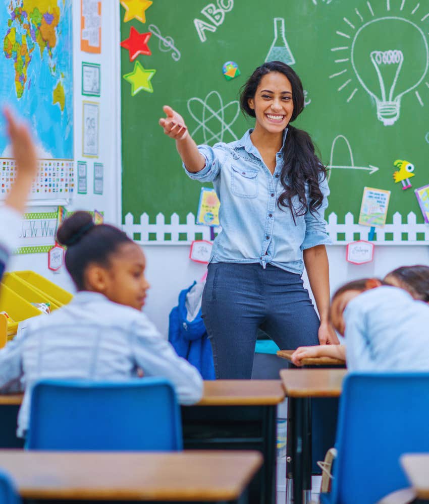 teacher calling on student in class