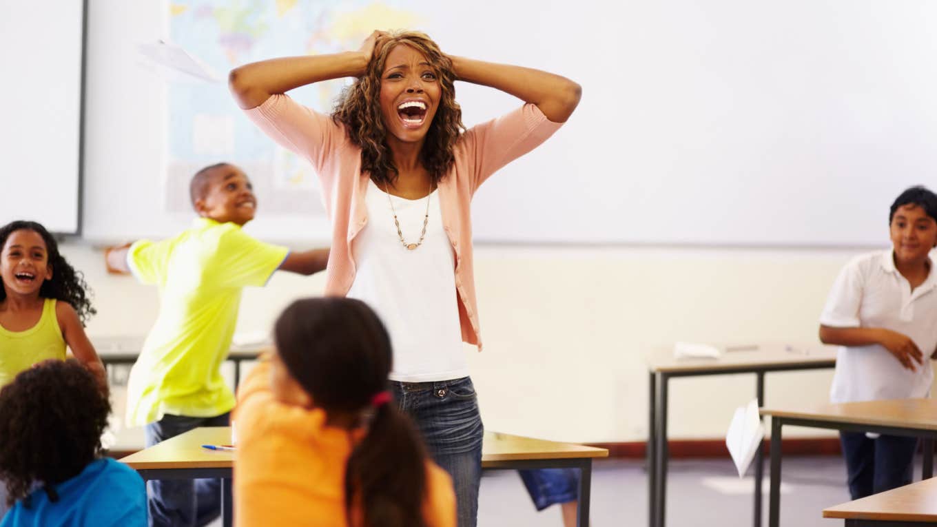 teacher overwhelmed by disorderly classroom