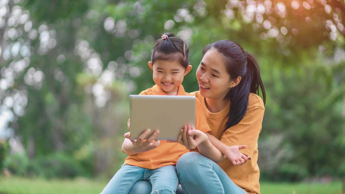 mom and daughter on iPad together