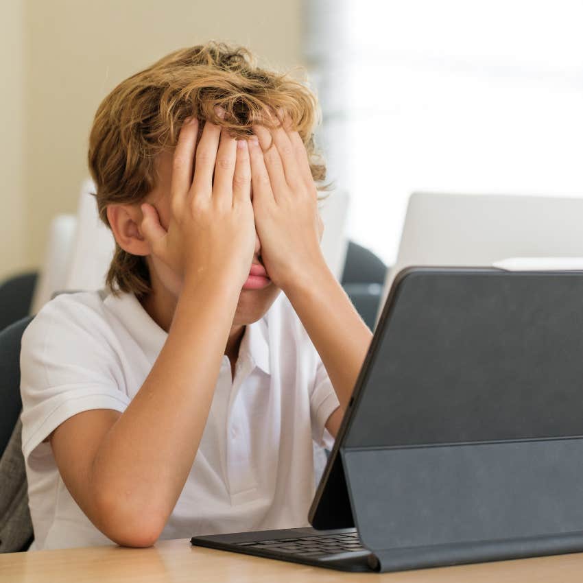 Tired student sitting at their desk. 