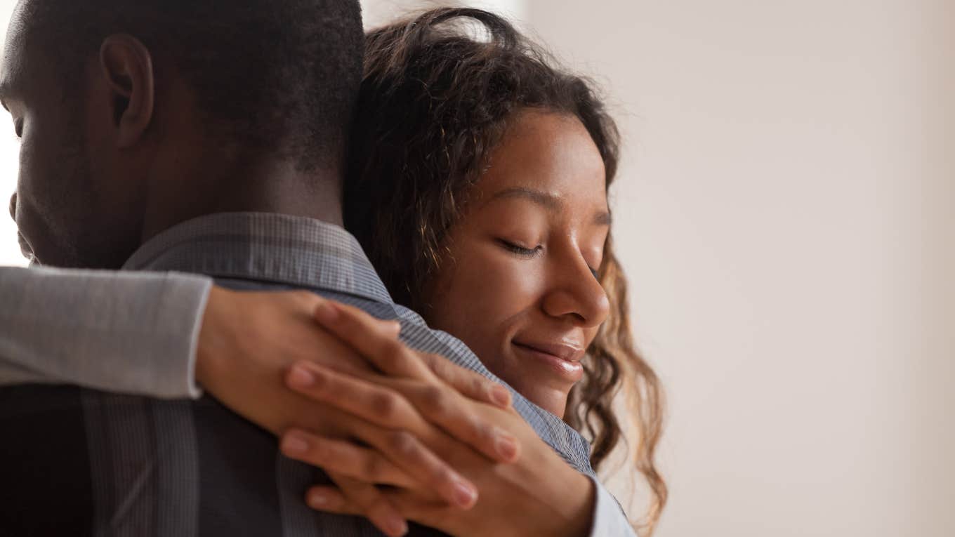 Trauma Coach Tells Women To Stop Taking Care Of Their Husbands Close up young black wife embracing husband