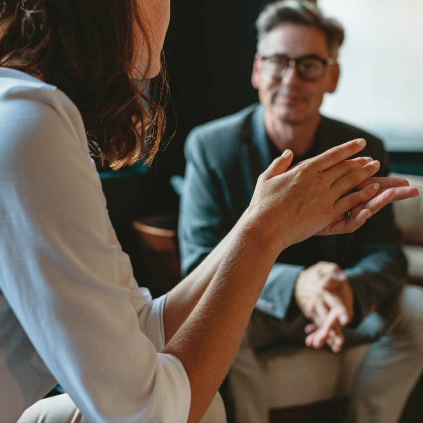 Two work peers having a conversation. 